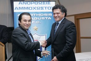 Mr. Christos Geranis, VP Anorthosis Famagusta F.C., presenting Mr. Michael A. Omerou, Simplex CEO, with the plaque